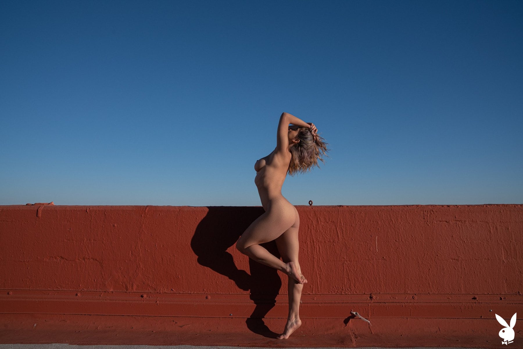 Mia Valentine on rooftop in black lingerie and fishnet getting naked